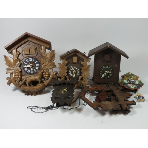 A collection of eight manual wind cuckoo clocks together with a multi