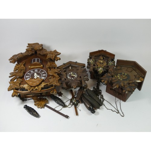 A collection of eight manual wind cuckoo clocks together with a multi