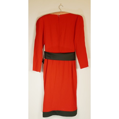 79 - Frank Usher red wool/crepe dress with black belt and trim detail to skirt, size 34inch chest.
