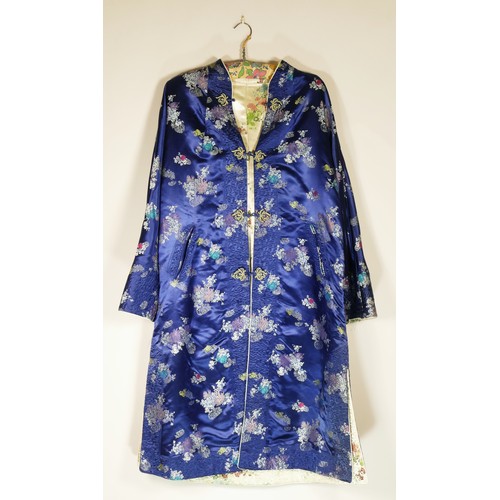 108 - A used satin brocade oriental dress coat, blue outer, cream inner reversible, 42inch chest.