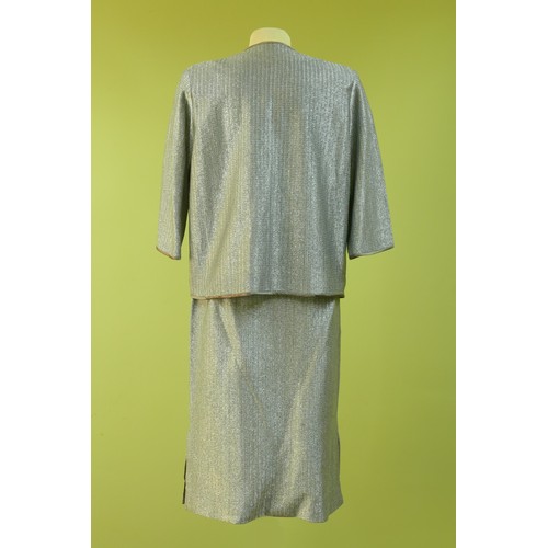 121 - Vintage silver fabric suit, circa mid 20th century. Comprising a silver shiny skirt, sleeveless blou... 