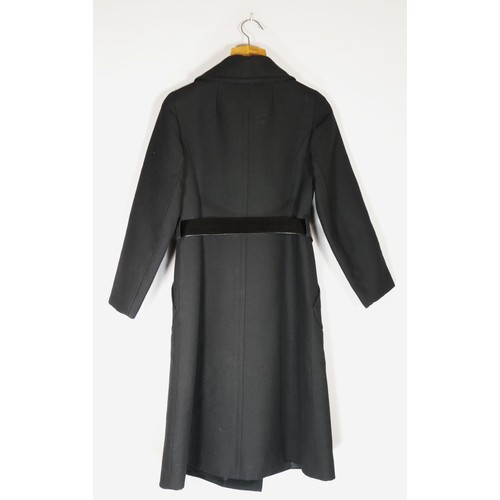 136 - Bickler design, black wool trench coat with patent belt. Size 36inch chest.