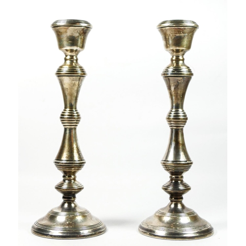 15 - A silver pair of baluster candlesticks, Birmingham 1981, 28cm, loaded