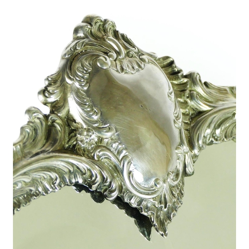 16 - A French silver large table mirror, by Armand Gross, Paris, c.1900, with floral scroll surround, bev... 