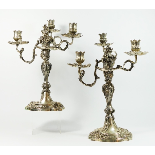 17 - A German 19th century pair of three light silver candelabra, Augsburg date letter P, by IPH, zigzag,... 