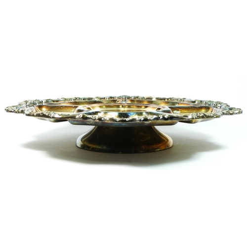 28 - An electroplated Lazy Susan serving dish, with applied floral border, raised on a spreading foot, di... 