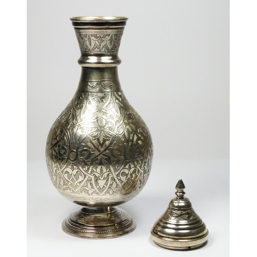 33 - An Egyptian silver lidded flask, Cairo, 0.900 standard, of baluster form with all over scroll engrav... 