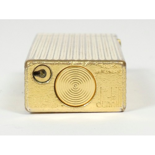 40 - Dunhill, a ribbed gold plated Rollagas lighter.
