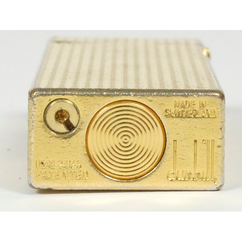 41 - Dunhill, a crosshatched gold plated Rollagas lighter.
