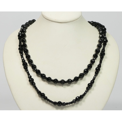 46 - A facetted French Jet glass bead necklace, and another similar, both 70cm (2)