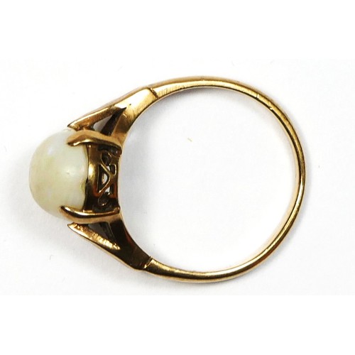 63 - A 9ct gold and cabochon opal single stone ring, 10 x 8mm, L, 2.2gm