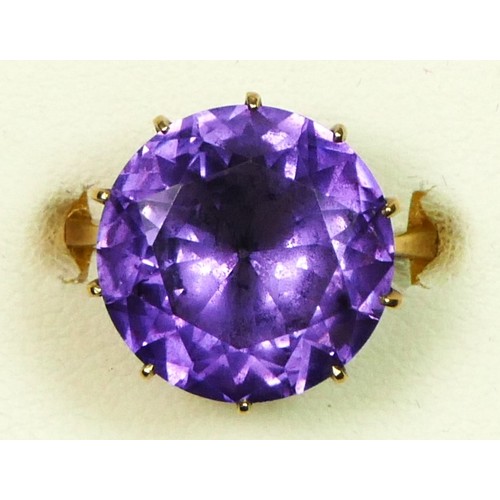 66 - A 9ct gold purple/blue colour change synthetic sapphire dress ring, diameter 15mm, M 1/2, 5.8gm
