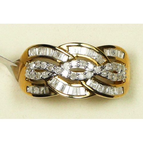 73 - A 9ct gold, brilliant and tapered baguette cut diamond dress ring,, stated weight 0.75cts, colour G/... 