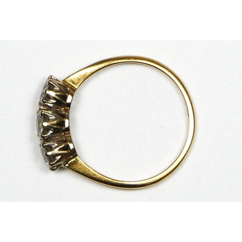 77 - An 18ct gold three stone diamond ring, claw set with old cut stones, total weight approximately 0.75... 