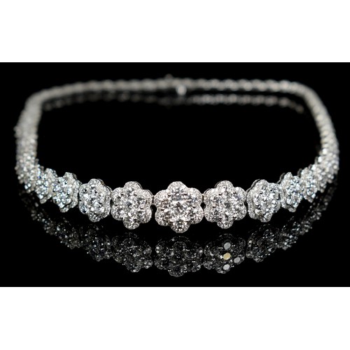 90 - An impressive 18ct white gold (750 stamp) and diamond cluster collarette necklace, composed of sixty... 