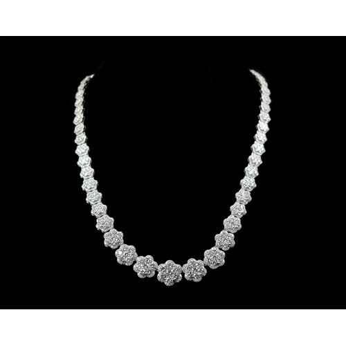 90 - An impressive 18ct white gold (750 stamp) and diamond cluster collarette necklace, composed of sixty... 