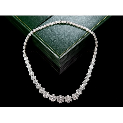 90 - An impressive 18ct white gold (750 stamp) and diamond cluster collarette necklace, composed of sixty... 