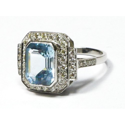 92 - An Art Deco style aquamarine and diamond panel ring, stamped PLAT, milligrain collet set with a step... 