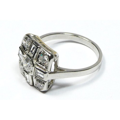 88 - An Art Deco style diamond set panel, the central brilliant cut stone approximately 0.30cts, bordered... 