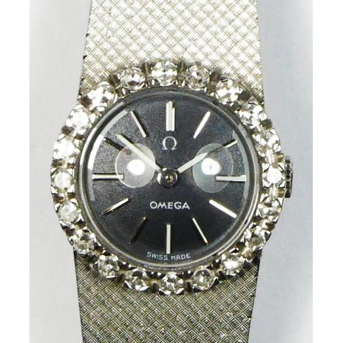 120 - Omega, an 18k white gold and diamond manual wind ladies wristwatch, c.1967, black enamel dial with b... 