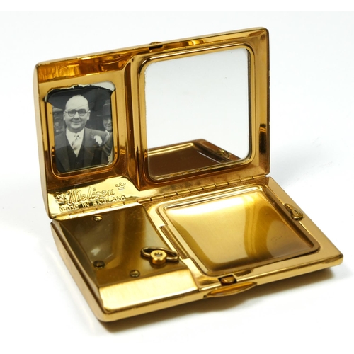 134 - Melissa, a gilt metal and mother of pearl musical ladies compact, 7.5 x 5 x 1.5cm, instructions, pou... 