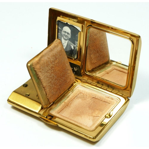 134 - Melissa, a gilt metal and mother of pearl musical ladies compact, 7.5 x 5 x 1.5cm, instructions, pou... 