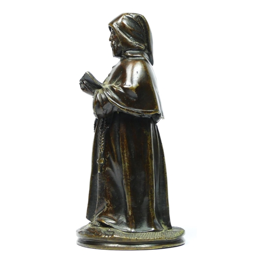 137 - A bronze novelty match holder, in the form of a monk, hinged at the waist, striker on the ground, 13... 