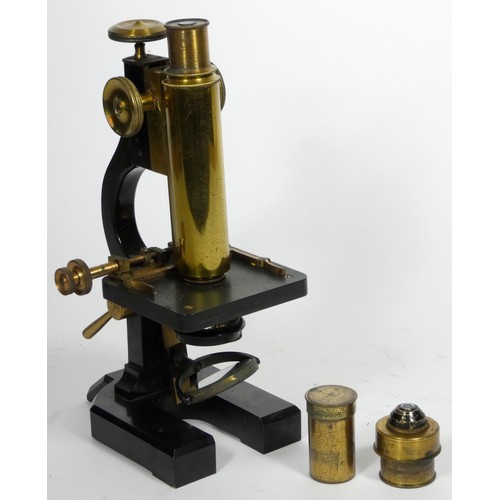 148 - An unbranded microscope, possibly made by R & J. Beck, London, metal construction with polished bras... 