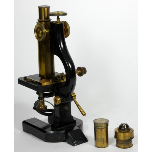 148 - An unbranded microscope, possibly made by R & J. Beck, London, metal construction with polished bras... 