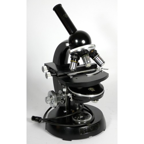 150 - A Carl Zeiss microscope, with three objective lens, black with polished hardware, 40cm tall, with ac... 