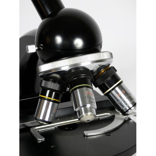 150 - A Carl Zeiss microscope, with three objective lens, black with polished hardware, 40cm tall, with ac... 