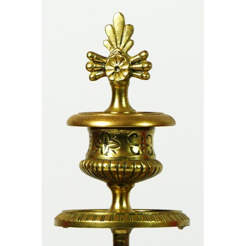 164 - A pair of gilt brass twin sconce candlesticks, supported on four, these give way to a square stepped... 