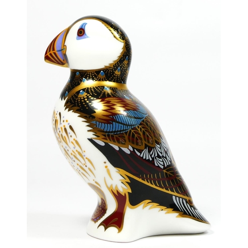 165 - A Royal Crown Derby paperweight modelled as a puffin, silver button, 11.5cm tall.