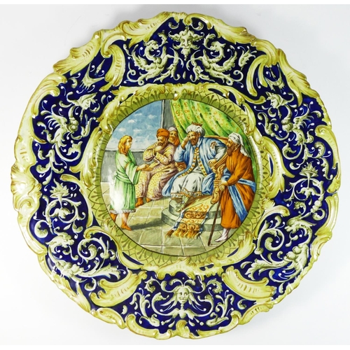 168 - A pair of Italian majolica chargers, crowned M, depicting mythological/biblical scenes, diameter 47c... 