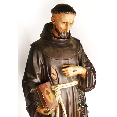 173 - An early 20th century painted plaster statue of a stigmata monk, 81cm