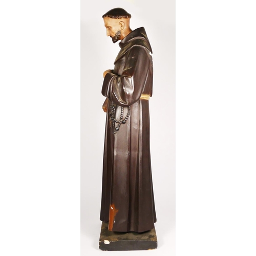 173 - An early 20th century painted plaster statue of a stigmata monk, 81cm