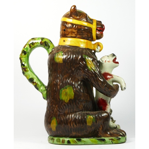 179 - A bear baiting advertising jar and cover, modelled as a large bear clutching a snarling dog between ... 