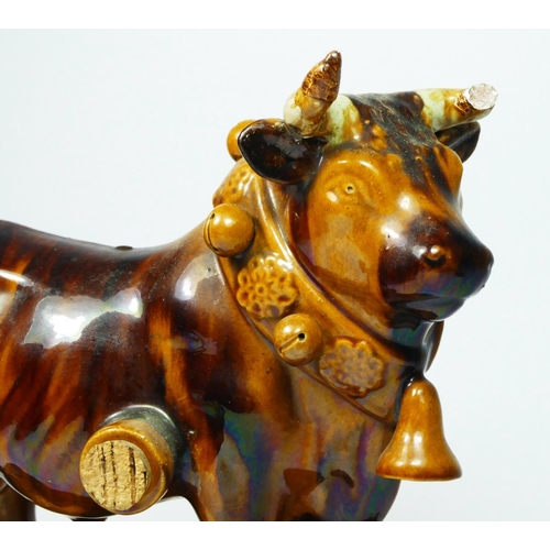 181 - A Mafra, Caldas, Portugal treacle glazed pottery novelty decanter, in the form of a bull, impressed ... 