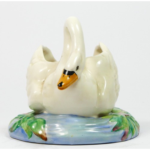 189 - A Clarice Cliff swan posy vase holder, circa 1940, modelled as an open backed swan on floral and wat... 