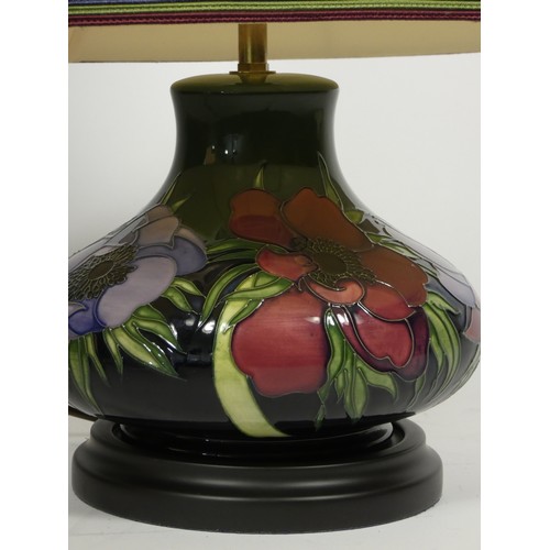 196 - Moorcroft, a contemporary tube lined Clematis pattern baluster lamp, 19cm.