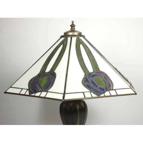 205 - Tiffany style leaded and stained glass lamp, by Interiors 1900, of hexagonal form, raised on a bronz... 