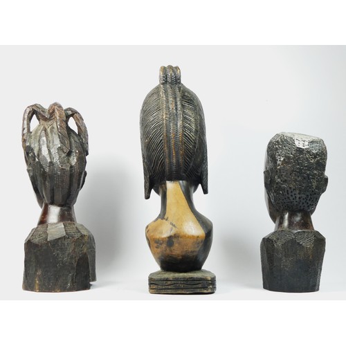 210 - A West African carved hardwood bust of a lady, 38cm and two smaller examples, 31 and 27cm (3).