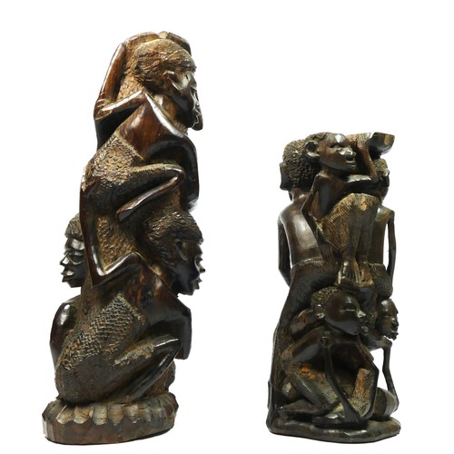 211 - A West African carved hardwood figure group of four men climbing a tree trunk, 33cm and another of a... 