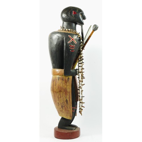 212 - A carved and painted wooden figure of a warrior, probably Ghanaian, 66cm.