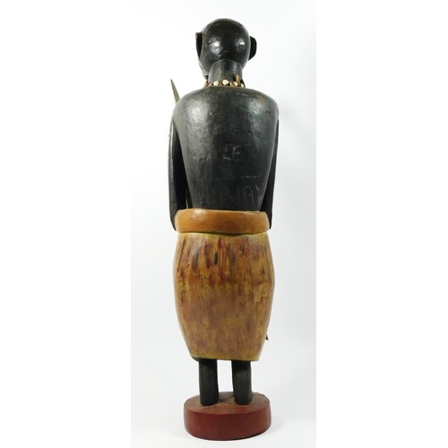 212 - A carved and painted wooden figure of a warrior, probably Ghanaian, 66cm.