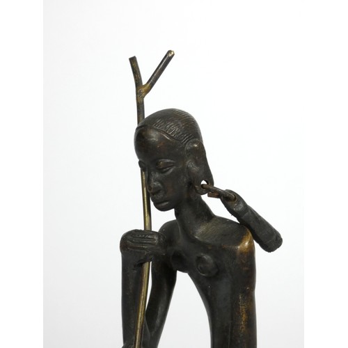 214 - An African cast bronze figure of a seated woman, 21cm,