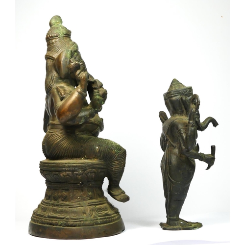 217 - An Indian brass seat Ganesh statue, 32cm and a standing example (2).