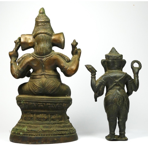 217 - An Indian brass seat Ganesh statue, 32cm and a standing example (2).