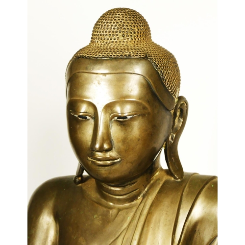 218 - A hollow cast Burmese bronze seated buddha, in the Mandalay style, probably late 19th century, 51cm.