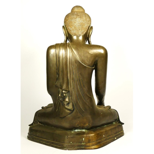 218 - A hollow cast Burmese bronze seated buddha, in the Mandalay style, probably late 19th century, 51cm.